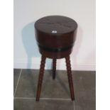 A French circular Butchers block with metal band standing on three bobbin turned splay legs - height