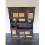 A carved Japanese Shibayama cabinet with a series of sliding doors, drawers and cupboard doors -