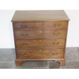 A good quality Georgian mahogany four drawer chest of small proportions on shaped bracket feet -