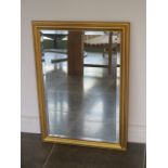A gilt framed wall mirror - 82cm x 59cm