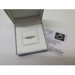 An 18ct white gold diamond solitaire ring, 0.37ct, with diamond shoulders, IGI certificate,