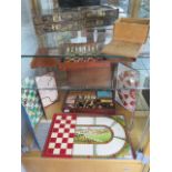 A mahogany games compendium, an Oriental chess/backgammon board, a part travelling chess set and