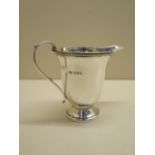 A silver cream jug Chester 1934/35 - height 10cm - approx weight 3.5 troy oz - some small dents