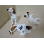 Three Royal Doulton puppy figures, sitting puppy 11cm tall, all good condition