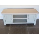 A TV stand with an oak top and painted grey base, 120cm wide x 50cm high