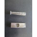 A silver cigar cutter, Birmingham 1967/68 WM ltd, 5cm long, generally good and a silver tamper,