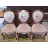 A set of three Victorian balloon back chairs, one leg repaired