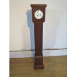 An oak case 8 day granddaughter clock with French striking movement - Height 126cm - cracks to
