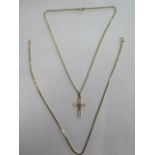 Two 9ct gold necklaces - one with a 9ct crucifix - 39cm and 40cm long - total weight approx 9