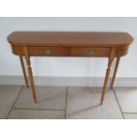 A new satinwood D shaped two drawer hall table on turned legs made by a local craftsman to a high