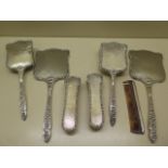 A seven piece silver backed dressing table set - some wear and denting but mirrors good