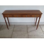 A new four drawer hall table on turned reeded legs made by a local craftsman to a high standard,