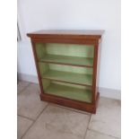 A new walnut open bookcase with a painted interior and adjustable shelving made by a local craftsman