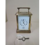 A large brass cased carriage clock with French movement, 8 day with hour / half hour strike also has