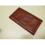 A Vintage crocodile skin gentleman's wallet with leather interior, 18cm x 10cm when closed, in