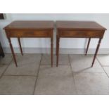 A pair of new walnut lamp tables with a single drawer on turned legs made by a local craftsman to