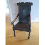 A carved oak wainscot type armchair, 100cm tall x 51cm wide x 56cm deep, some old worm and