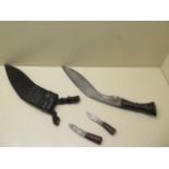 A horn handle Kukri with 31cm blade in leather covered wood scabbard together with its