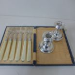 A pair of weighted dwarf candlesticks - Height 8cm - and a boxed set of six silver and ivory 1900