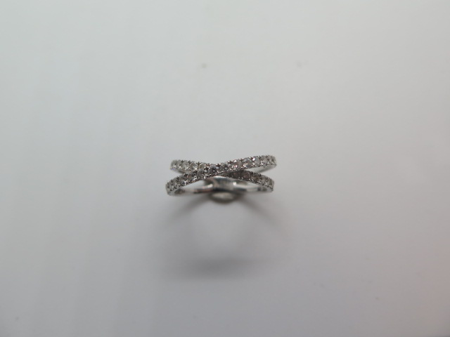 An 18ct white gold diamond crossover ring marked 750 size J/K - approx weight 2.2 grams - in - Image 2 of 3