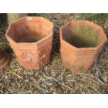 A pair of terracotta octagonal planters, 39cm tall x 40cm wide