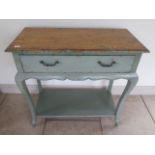 A shabby chic painted side table with an oak top above a drawer and undertier, 92cm tall x 95cm x