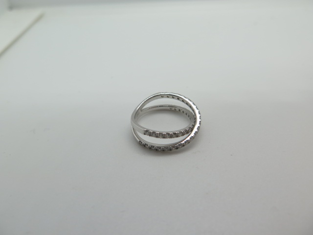 An 18ct white gold diamond crossover ring marked 750 size J/K - approx weight 2.2 grams - in - Image 3 of 3