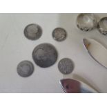 Five silver rings, a crucifix, two silver butter knives and five coins, total weight approx 2.2 troy