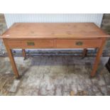 A 19th century pine two drawer side table, 75cm tall x 129cm x 53cm