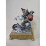 A Capodimonte figure of Napoleon on horseback on an ormolu stand - height 35cm - generally good,