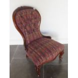 A 19th century mahogany nursing chair