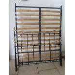 A Feather and Black 5ft king size ' brass and metal Victorian style bed in good condition