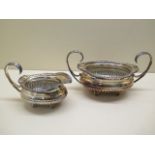 An Elkington and Co silver twin handle sugar bowl and milk jug London 1899 and 1900 - total weight