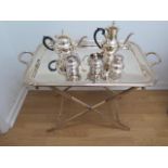 A large Cesa 1882 silver plated tray on a folding plated stand with an Arthur Price plated four