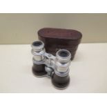 A pair of polished aluminium and crocodile binoculars for racing or opera with crocodile covering