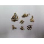 A collection of seven 9ct gold charms, total weight approx 7.9 grams, all generally good