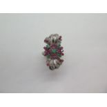 An impressive multi-gem white metal ring set with diamonds, rubies and emeralds, believed to be