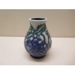 A small Moorcroft vase - Height 10cm - some crazing to glaze otherwise generally good