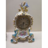 A French porcelain mantle clock with a Japy Freres movement silk suspension striking on a bell -