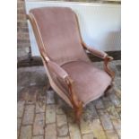 A Victorian upholstered open armchair, 90cm tall x 64cm wide