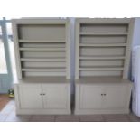 A pair of handmade country house painted bookcase cabinets, each with an adjustable shelved top