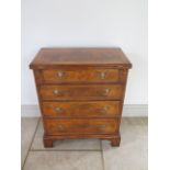 A new walnut Bachelors chest of small proportions with a fold over top above four drawers, made by a