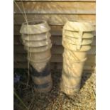 A pair of Doulton Lambeth stoneware chimney pots, 92cm tall, cracking to top of one but generally