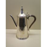 A silver coffee pot - London 1988 - maker RC for Lloyds of London Tercentenary - Height 27cm -