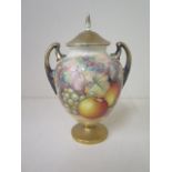 A Royal Worcester fine bone china twin handle lidded vase with fruit still life on a mossy bank