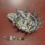 A Lego Star Wars Millennium Falcon with seven mini figures - has not been checked, no box or