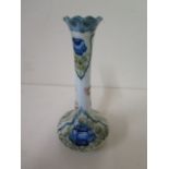 A Moorcroft MacIntyre single stem vase - height 15cm - with green signature, small chips to base and