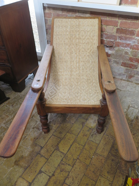 An early 20th century hardwood colonial planters chair, 83cm tall x 117cm deep, without extensions - Image 2 of 2