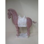 A terracotta Chinese Tang type horse, 54cm tall x 52cm long, in generally good condition