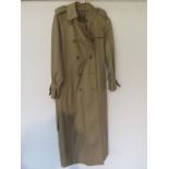 A Ladies Burberry's rain coat in good clean condition , length from collar 126 cm , armpit